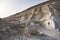 Layered formations in limestone hills due to water in the Kazakh steppe