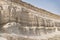 Layered formations in limestone hills due to water in the Kazakh steppe