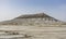 Layered limestone chalk mountain Bokty in the middle of Kazakh steppe