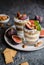 Layered mascarpone dessert with crushed vanilla biscuits, figs and almonds