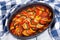 Layered ratatouille in a baking dish, close-up