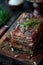 Layered raw steak seasoned with herbs on a wooden board.