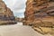 Layered rocks of the beach of Cathedrals in summer cloudy day, a