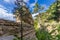 Layered rocks structure with coniferous forest on a clear day