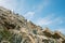 Layered rocks with vibrant blue sky