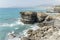 Layered rocks of worn cliffs on Tigullio coast, Cavi, Italy