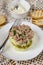 Layered salad with grated potatoes, cheese, pickles and canned cod liver