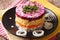 Layered salad with herring, beets, carrots, onions, potatoes and