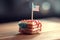 layered sponge mini cake decorated by USA flag in patriotic colours. American Independence Day.