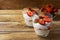 Layered strawberry dessert on wooden background