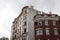 Layers of brick faced urban housing buildings with ornate architectural details