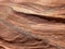 Layers on a red sandstone cliff