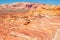 Layers of rock similar to swirled ice cream create unique shapes in the Arizona desert