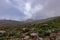 layers of rocky hillsides lead back into fog bank