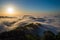 Layers of surging clouds are very spectacular. Sunset behind the mountains.