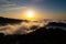 Layers of surging clouds are very spectacular. Sunset behind the mountains.