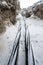 Laying a fiber optic and electricity cables in the frozen ground