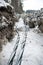 Laying a fiber optic and electricity cables in the frozen ground