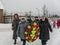 Laying flowers and funeral wreaths at a mass grave in the Kaluga region in Russia.