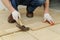 Laying hardwood parquet.