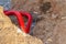 Laying an insulating plastic pipe with an electric cable underground during the construction of a house