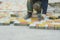 Laying Paving Slabs by mosaic close-up. Road Paving, construction. Repairing sidewalk. Worker laying stone paving slab.