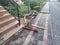 Laying paving stones. Measuring the slope with a spirit level. Laying paving stones on sand. A spirit level for measuring in