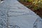 Laying porphyry of large flat stones. the paving is laid in some gravel, the joints are then filled with pebbles. garden nature pa