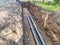 Laying of underground communications for residential buildings. black plumbing pipes made of durable and reliable material are