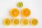 He layout of the circles of oranges, lemons, lime on a white background in the form of a pyramid
