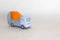 layout of concrete truck mixer on rough white-grey background. Free copy space. Delivery of ready mix concrete on job-site.