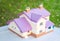 Layout of a house made of paper. Paper miniature beige cottage w
