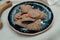 Layout of linen breads with chilly pepper on spotted ceramic plate