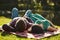 Those lazy afternoons with the one you love. a young couple lying together on a picnic blanket in the park.