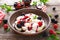 Lazy dumplings, vareniki with fresh berries. Boiled cottage cheese gnocchi with sour cream, raspberry and blackberry. Traditional