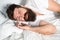 Lazy morning. Relax and sleep concept. Man bearded guy sleep on white sheets. Healthy sleep and wellbeing. Man bearded