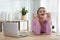 Lazy worker at wooden desk in office