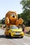 The LCL yellow mascot during the passing of the publicity caravan on the road during Le Tour de France on july month