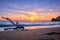 ld wood trunk snag in water at beach on beautiful sunset