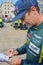 LE MANS, FRANCE - JUNE 11, 2017: Austrian race car driver Mathias Lauda Aston Martin Racing in the uniform gives autograph during