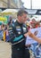 LE MANS, FRANCE - JUNE 11, 2017: Race car driver Christian Ried Dempsey Proton Racing in the uniform gives autograph during parade