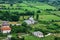 Lead Mosque without minarets among green fields in a valley near Shkoder Albania - top view. Beautiful landscape with