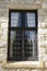 Leaded glass window in stone wall