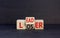 Leader or loser symbol. Concept word Leader Loser on wooden cubes. Beautiful black table black background. Business and leader or