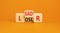 Leader or loser symbol. Concept word Leader Loser on wooden cubes. Beautiful orange table orange background. Business and leader