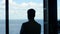 Leader man silhouette thinking sea panorama window. Business lifestyle concept