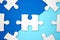 Leadership business concept - jigsaw on blue geometry background