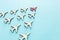 Leadership concept with airplanes on blue wooden background. One red leader flays ahead others.