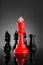 Leadership Red Chess King with pieces on dark background