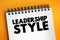 Leadership style - leader`s method of providing direction, implementing plans, and motivating people, text concept on notepad